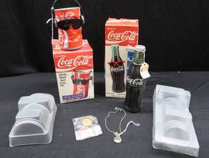 lot 36 image: COCA-COLA BOPPING BOTTLE AND BREAK DANCING CAN WITH BONUS COKE NECKLACE AND BOTTLECAPS