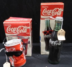 lot 41 image: COCA-COLA BOPPING BOTTLE AND BREAK DANCING CAN WITH BONUS COKE NECKLACE AND BOTTLECAPS