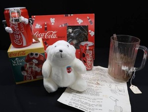 lot 40 image: VINTAGE COCA-COLA BANK, LIQUID ILLUSION, OLYMPIC CAN, LIGHT SET, AND BONUS POLAR BEAR