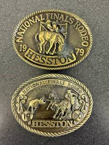 lot 34 image: 1979 & 1980 Hesston National Finals Rodeo Belt Buckles