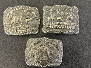 lot 37 image: 1985, 1986 & 1987 Hesston National Finals Rodeo Belt Buckles