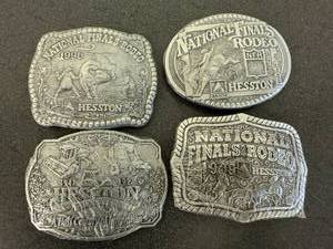 lot 42 image: 1996, 1997, 1998 & 1999 Hesston National Finals Rodeo Belt Buckles