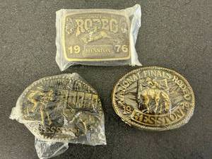 lot 45 image: 1976, 1978 & 1979 Hesston National Finals Rodeo Belt Buckles