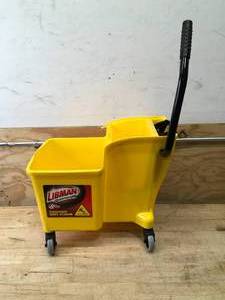 lot 70 image: Libman One-Piece Commercial Mop Bucket and Wringer (Retails for $69.98)
