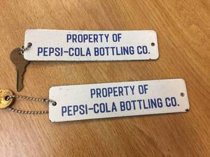 lot 188 image: Pair Vintage Property of Pepsi-Cola - KeychainsCrate Badge