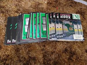 lot 6 image: Stack of (22) Fighting Sioux Hockey Programs from the 80s90s
