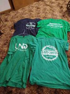 lot 39 image: (4) UND T-shirts