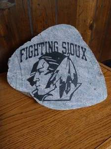 lot 72 image: Heavy Carved Fighting Sioux Rock