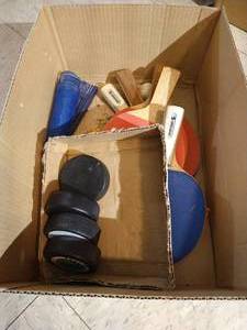 lot 137 image: Box of Ping Pong Items & Some Fighting Sioux Pucks