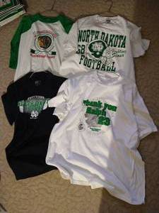 lot 196 image: (4) UND T-Shirts