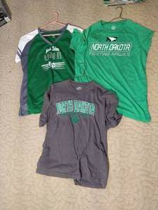 lot 208 image: (3) UND Tshirts