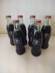 lot 230 image: (6) Unopened 2001-02 Fighting Sioux Engelstad Arena Coke Bottles