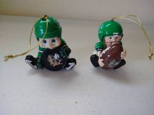 lot 280 image: (2) Fighting Sioux Christmas Ornaments - Football & Hockey
