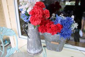 lot 9 image: Rustic Metal Flower Vases with Artificial Patriotic Floral Arrangements