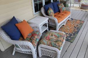 lot 15 image: 5-Piece Wicker Patio Furniture Set with Colorful Cushions