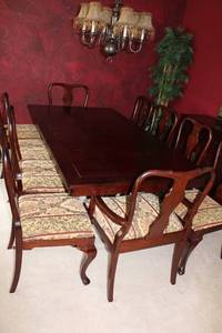 Elegant Dining Table with 10 Chairs and Extra Leaf