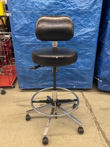 lot 44 image: MSRP $1000 High Quality Biofit Regent Height Adjustable Chrome Bench Height Stool Chair With Adjustable Foot Ring - Black - Great Condition - Seat Fabric Has Small Wear Spot In Front&nbspBacked by a 13-year warranty with lifetime warranty on pneumatics.