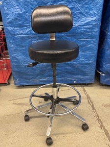 lot 45 image: MSRP $1000 High Quality Biofit Regent Height Adjustable Chrome Bench Height Stool Chair With Adjustable Foot Ring - Black - Great Condition - Seat Fabric Has Wear Spot On Back&nbspBacked by a 13-year warranty with lifetime warranty on pneumatics.