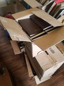 lot 6 image: 5 Boxes of Louis Lamour Leather Book Collection. Very Nice