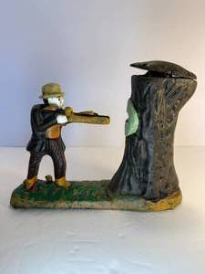 lot 3 image: Teddy and the Bear cast iron mechanical bank. This bank is in good working condition.