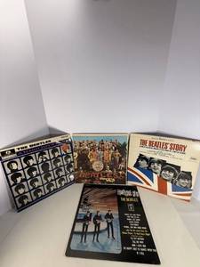 lot 21 image: Four Beatle Albums. All albums are in protective sleeve.