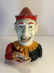 lot 23 image: Humpy Dumpty clown cast iron mechanical bank. This bank is in good working condition. 