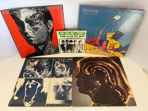 lot 13 image: Four Rolling Stones Albums and one 45 Record. All albums and record are in a protective sleeve.