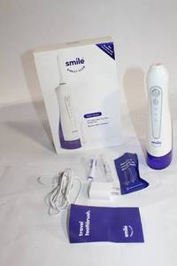 lot 135 image: Smile Direct Club Water Flosser with Accessories