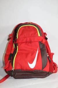 lot 159 image: Red and Brown Nike Backpack with Lime Green Interior
