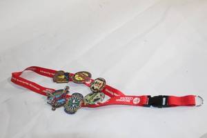 lot 174 image: Collection of 6 Softball Trading Pins on Red Lanyard
