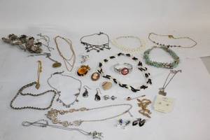 lot 242 image: Assorted Jewelry Collection featuring Necklaces, Earrings, Bracelets, and Brooches