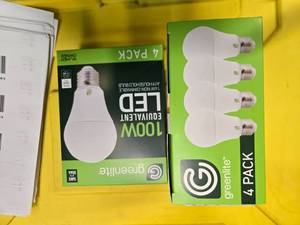 lot 79 image: Lot of 8 LED Greenlite 100W Equivalent Light Bulbs (4 packs in each of the two boxes) New