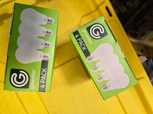 lot 85 image: Lot of 8 LED Greenlite 100W Equivalent Light Bulbs (4 packs in each of the two boxes) New