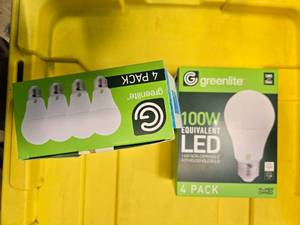 lot 87 image: Lot of 8 LED Greenlite 100W Equivalent Light Bulbs (4 packs in each of the two boxes) New