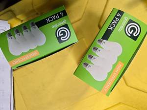 lot 94 image: Lot of 8 LED Greenlite 60W Equivalent Light Bulbs (4 packs in each of the two boxes) New