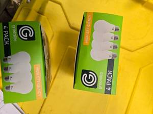lot 95 image: Lot of 8 LED Greenlite 60W Equivalent Light Bulbs (4 packs in each of the two boxes) New