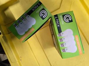lot 102 image: Lot of 8 LED Greenlite 100W Equivalent Light Bulbs (4 packs in each of the two boxes) New