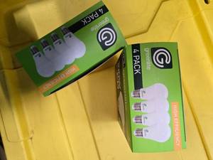 lot 103 image: Lot of 8 LED Greenlite 100W Equivalent Light Bulbs (4 packs in each of the two boxes) New