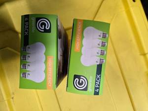 lot 104 image: Lot of 8 LED Greenlite 100W Equivalent Light Bulbs (4 packs in each of the two boxes) New