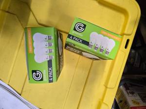 lot 105 image: Lot of 8 LED Greenlite 100W Equivalent Light Bulbs (4 packs in each of the two boxes) New