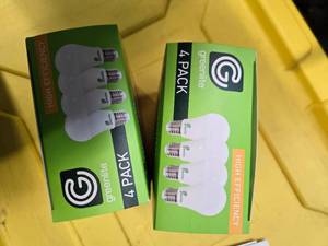 lot 109 image: Lot of 8 LED Greenlite 100W Equivalent Light Bulbs (4 packs in each of the two boxes) New
