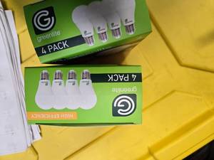 lot 110 image: Lot of 8 LED Greenlite 100W Equivalent Light Bulbs (4 packs in each of the two boxes) New