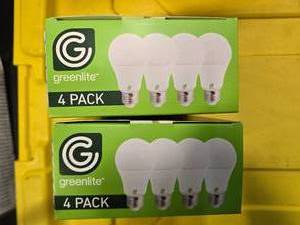 lot 83 image: Lot of 8 LED Greenlite 100W Equivalent Light Bulbs (4 packs in each of the two boxes) New