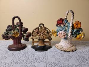 lot 310 image: Antique Cast Iron Flower Basket Doorstops, B
