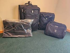lot 719 image: Travelpro Carry-On Luggage Bundle