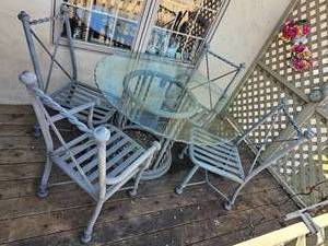 lot 44 image: Wisted Cast Aluminum Patio Table Set with Scalloped Edge Glass Top
