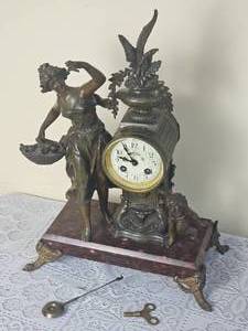 lot 49 image: French Victorian Bronze Mantel Clock Women with Basket & Cherub