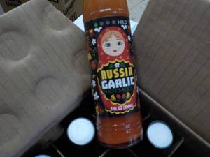 lot 192 image: 36 ct Russia Garlic Hot Sauce...