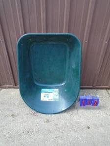 lot 113 image: Poly wheelbarrow tub. As shown.