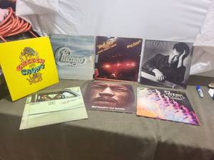 lot 235 image: Collection of 7 Vintage Vinyl Records Featuring Cheech & Chong, Billy Joel, and Jimi Hendrix